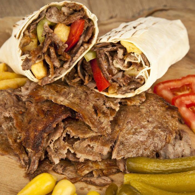 Ozkans Grill two doner wraps served with sliced meat, fries, pickles, and fresh tomato in Berwick.